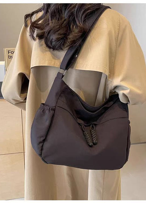 Adjustable Canvas Shoulder Bag with Multiple Pockets