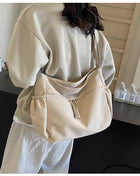 Adjustable Canvas Shoulder Bag with Multiple Pockets